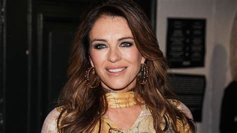 Elizabeth Hurley Glows In Revealing Black Swimsuit As She Takes Fans