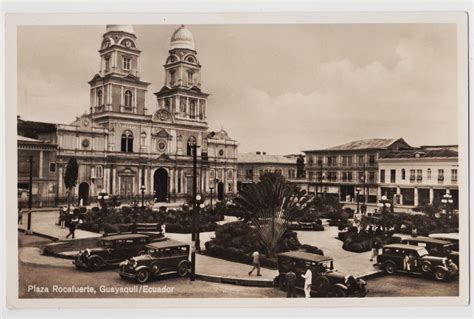 An Old Black And White Photo Of Cars Parked In Front Of A Building With