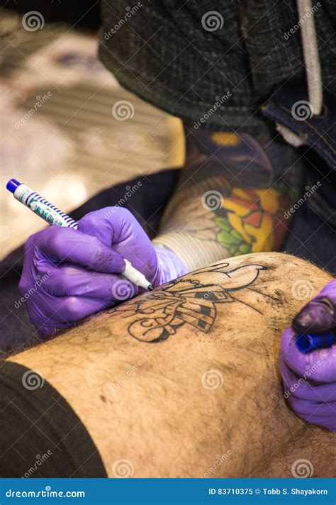 Professional Tattoo Artist Makes A Tattoo Editorial Image Image Of