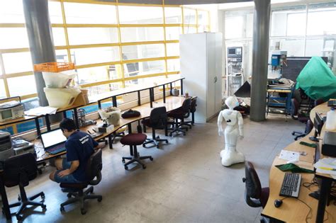 Student understanding the two cylinders and their pistons are identical, but the piston in the second is shown in the diagram at a greater height than that in the first. Left: Mechatronics Lab. Center: South Hall. Right: Pepper ...