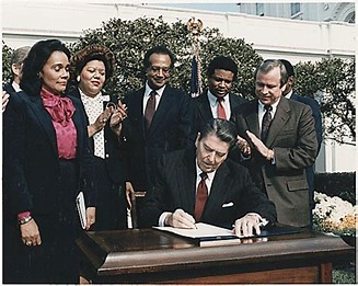 Image result for Ronald Reagan signed a bill establishing a federal holiday on the third Monday of January in honor of civil rights leader Dr. Martin Luther King Jr.
