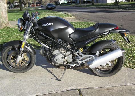 Ducati's profilation of this bike. 2005 Ducati Monster 620 Dark - Moto.ZombDrive.COM
