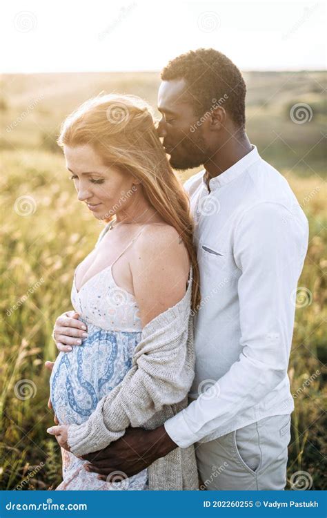 Multiracial Pregnant Couple In The Park Outdoor Stock Image Image Of