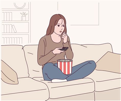A Woman Is Sitting On The Couch And Eating Popcorn And Watching A Movie