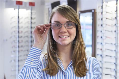 Woman Choosing Glasses In Opticians Stock Image Image Of Opticians Exam 51126717