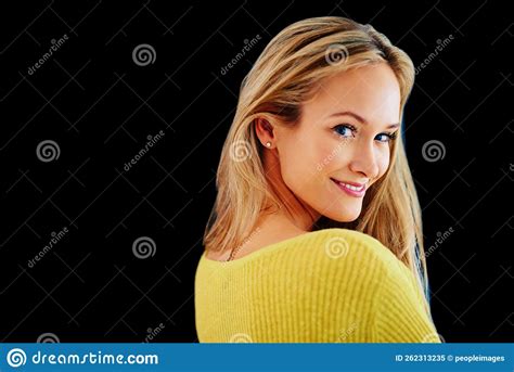 Giving You A Coy Smile Studio Portrait Of A Beautiful Young Blonde