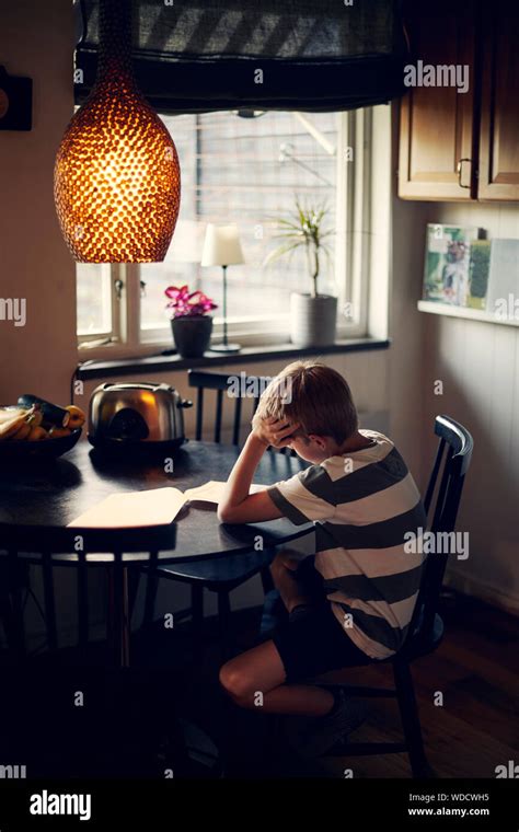 Boy Sitting On The Dining Table Hi Res Stock Photography And Images Alamy