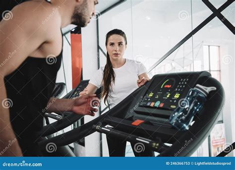 Attentive Trainer Looking At Sportsman Running Stock Image Image Of