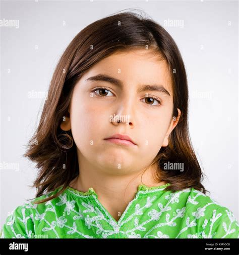 Portrait Of A Little Girl Making A Serious Expression Stock Photo Alamy