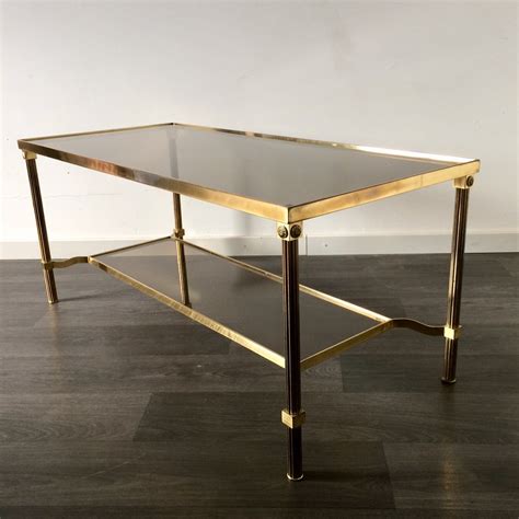 If you've got a scandinavian modern theme in mind, go for a beautiful teak coffee table by dane johannes andersen, or perhaps an oak piece by hans j wegner. Midcentury Design French Empire Smoked Glass & Brass ...