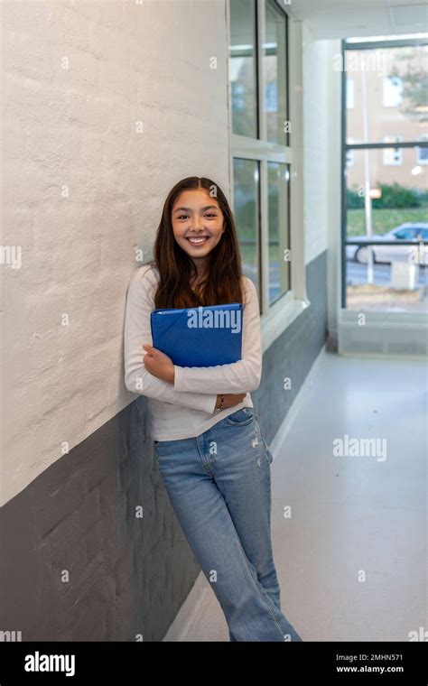 Portrait Of Teenage Girl Standing On School Corridor Stock Photo Alamy