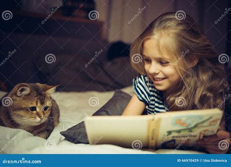 Smiling Girl Reads Book To A Cat Stock Image Image Of Female Leisure