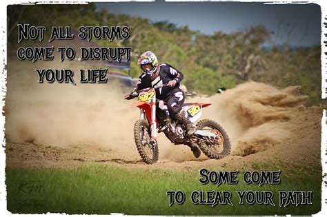 A Man Riding A Dirt Bike On Top Of A Dirt Field With Words Above It