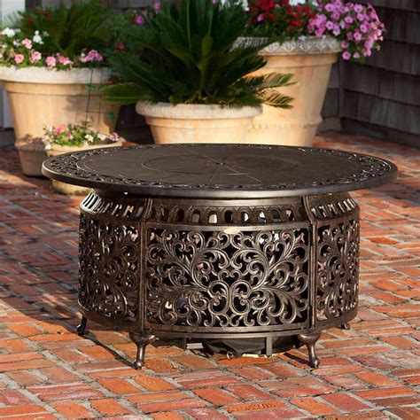 Round solid fire pit table,gives a cozy sensation to your backyard.it has copper accents and decorative cast iron legs.the lid converts the pit strathwood st. Sedona Cast Aluminum Round Gas Fire Table | Fire pit, Fire ...