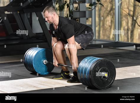 Deadlift Attempt Young Man Trying To Lift Heavy Barbell Stock Photo