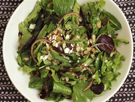 Place raisins into a bowl, cover with boiling water, and let stand to plump. Mixed Green Salad with Feta, Golden Raisins and Almonds ...