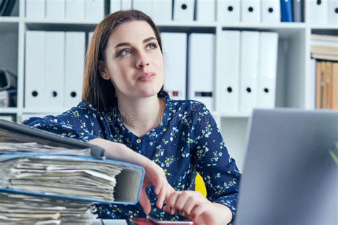Business Woman Or Secretary With Many Documents Folders Bills On Her Desk Taking Break Relaxing