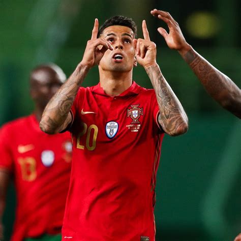 Download Joao Cancelo Points Up Wallpaper | Wallpapers.com