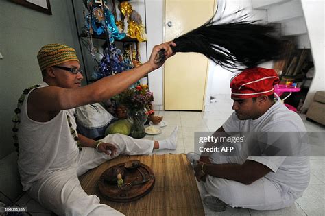 A Babalawo A Priest In The Yoruba Religion Performs A Spiritual
