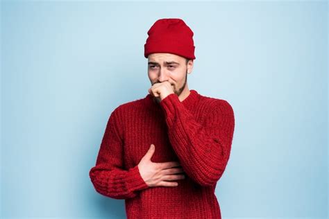 Premium Photo Boy Caught A Cold And Has Cough Studio On Cyan Background