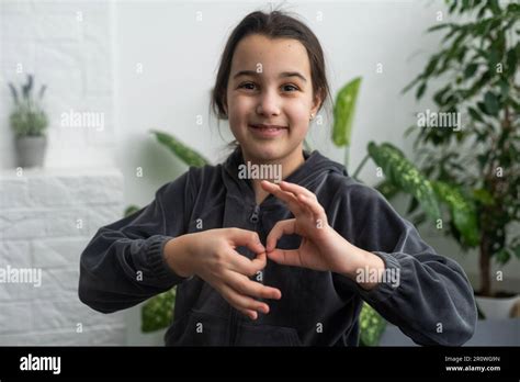 Beautiful Smiling Deaf Girl Using Sign Language Stock Photo Alamy