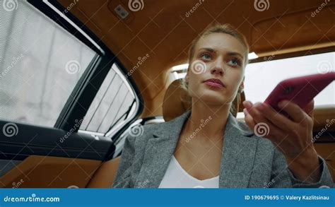 Portrait Of Female Riding At Backseat At Car Woman Calling Mobile
