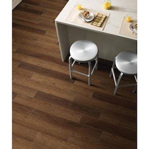 Vinyl floors are common options in kitchens and bathrooms, and they are beautiful when properly maintained. SMARTCORE 11-Piece 5-in x 48.03-in Coweta Oak Luxury Locking Vinyl Plank Flooring at Lowes.com ...