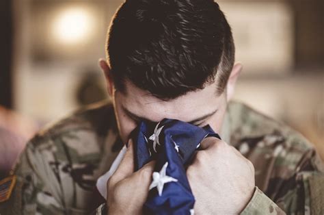 Free Photo American Soldier Mourning And Praying With The American
