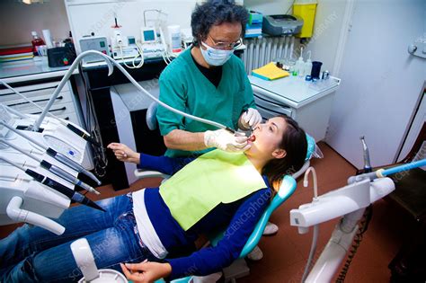 Check spelling or type a new query. Woman undergoing dental examination - Stock Image - C033 ...