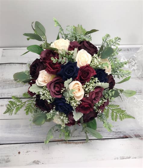 A wedding flower bouquet has to connect with the bride, visually and emotionally. Navy &burgundy bouquet,Wedding bouquet ,wine,ivory ,dark ...