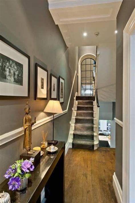 Small Hallway Decor With Wall Framed Photos And Grey Walls Small