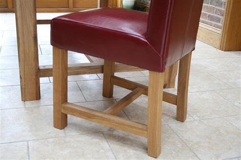 The understated ribbed fabric and slim powder coated legs give this dining chair a robust, yet elegant, look&feel. Titan Full Leather Chair | Scroll Back Leather Dining ...