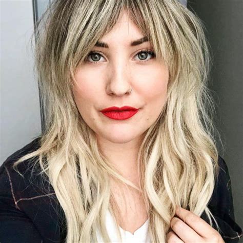 Straight layered hair with parted fringe. Women's Mod Feathered Shaggy Mullet with Beveled Fringe ...