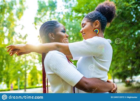 brazilian lesbian couple in white dress spending time together celebrating engagement in summer