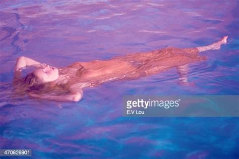 Young Woman Swimming Underwater In Pool In Underwear Photo Getty Images