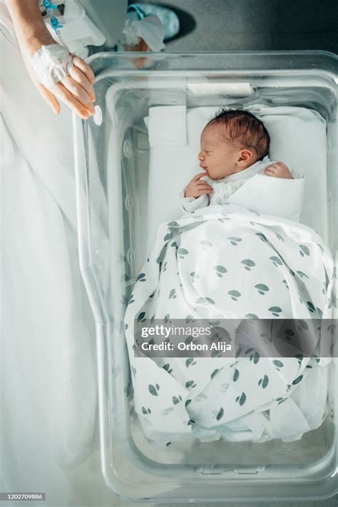 Newborn Baby Sleeping In Hospital Bassinet High Res Stock Photo Getty