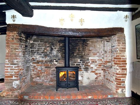These fireplaces burn a gel substance that usually comes in a can to produce flames. Inglenook with stove | Inglenook, Fireplace, Inglenook ...