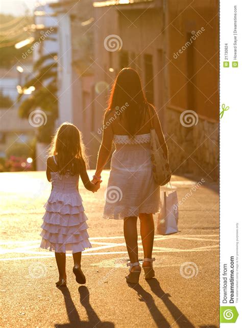 Mother And Daughter Walking Stock Images Image 21730824