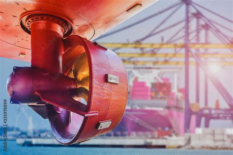 Red Propeller In Rope Guard With Rudder Under Ship Repairing In