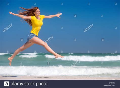 Leaping Woman Stock Photos And Leaping Woman Stock Images Alamy