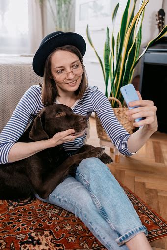 Young And Cheerful Caucasian Woman Taking Selfies With Her Dog European