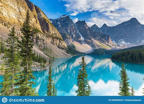 Beautiful Turquoise Waters Of The Moraine Lake With Snow Covered Rocky