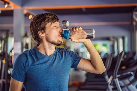 Sport Man Drinking Water In The Gym Stock Photo Image Of Healthy
