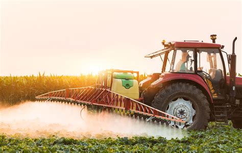 Tractor Spraying Vegetable Field At Spring Hygeia Analytics