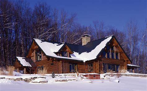 12 Snow Covered Log Cabins