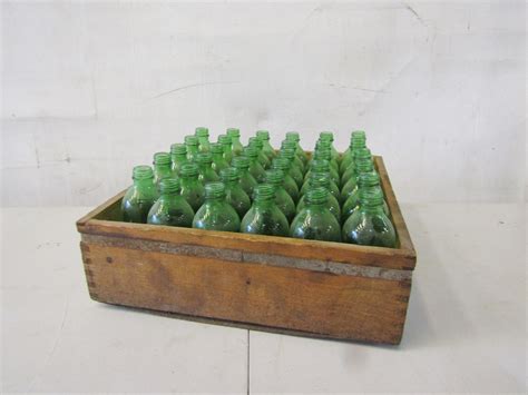 2200110 Wooden Crate With Green Glass Bottles H 18 Cm X 37 X 38 X 2 Off Stockyard Prop And