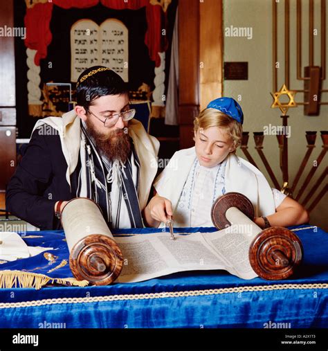 Jewish Ceremony Bar Mitzvah Instruction Rabbi With Young Boy Stock