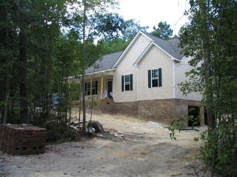 Walkout basement house plans typically accommodate hilly/sloping lots quite well. Side entry basement garage, without a crazy slope off of ...
