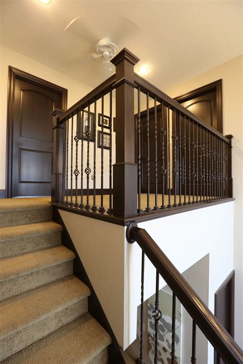A photo gallery of 101 amazing staircase design ideas plus our types of stairs chart that explains the parts of a staircase and types of staircases. Stair Systems | dark stain, with wrought iron balusters | Bayer Built Woodworks, Inc ...