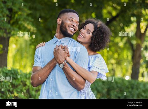 Loving African American Couple Hugging In Summer Park Stock Photo Alamy